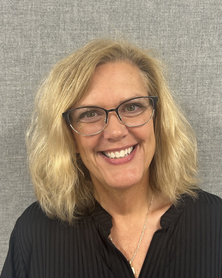 A photo of Kristi Turner, smiling at the camera. 